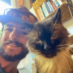 pet sitter with a cat in St. Louis 4-Legged Kids, INc.