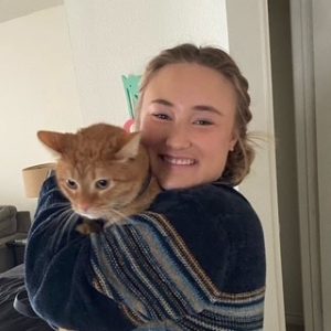 4-Legged Kids Cat Sitter holding yellow cat